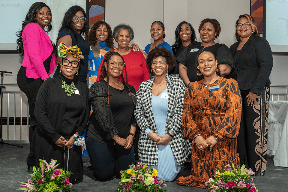 Members of the Black Alumni Association and Board pose for a photo.