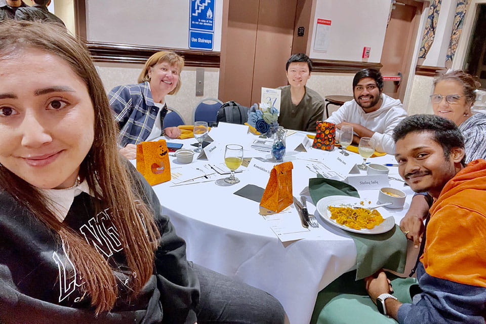 Students at a meal during a Billiken Home Plate event.