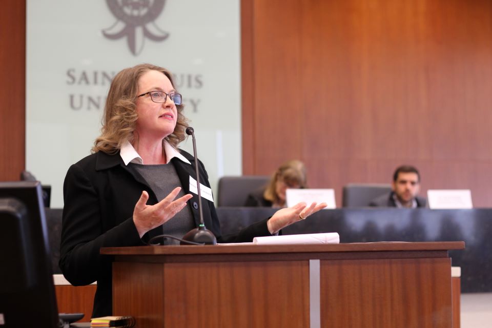 Marcia McCormick, a member of the William C. Wefel Center for Employment Law, speaks at the podium in Scott Hall