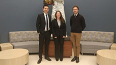 ilikenChe-Hsien Lin, Jeremiah Polander, Jessica Smith posed together in front of a statue 